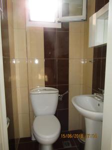 a bathroom with a toilet and a sink at Maria-Villa in Psakoudia +31 photos