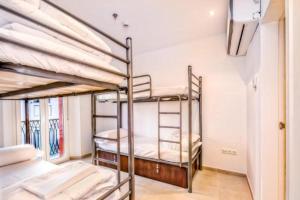 Ein Bett oder Betten in einem Zimmer der Unterkunft Hostel A2C