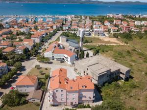 an aerial view of a city with houses and the ocean at Sunset View Apartment in Zadar