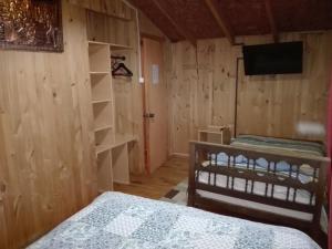 TV a/nebo společenská místnost v ubytování Hospedaje Los Calafates