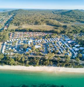 an aerial view of a resort on a beach at Shoal Bay Holiday Park in Shoal Bay