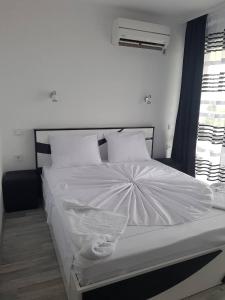 Postel nebo postele na pokoji v ubytování Guest House Evtimov