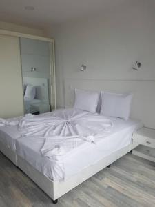 Postel nebo postele na pokoji v ubytování Guest House Evtimov