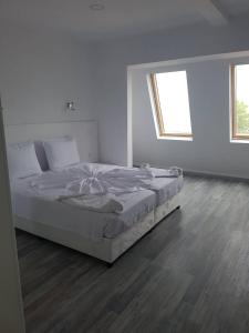 Postel nebo postele na pokoji v ubytování Guest House Evtimov