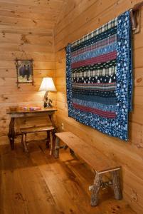 a wooden room with a bench and a rug on the wall at The Dogwood Breeze in Aquone