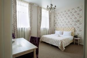 Кровать или кровати в номере Бутик-отель Аристократ 