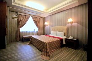 Postel nebo postele na pokoji v ubytování Spring City Motel