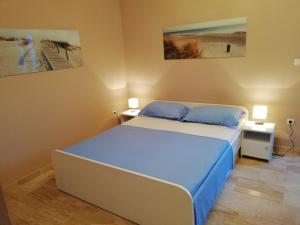 Postel nebo postele na pokoji v ubytování Apartmani Karla