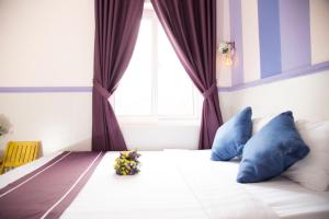 Postel nebo postele na pokoji v ubytování Q Songchi Hotel