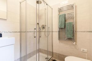 a bathroom with a glass shower with a toilet at Ca' della scala in Venice