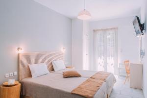 Posteľ alebo postele v izbe v ubytovaní Hotel Semeli + 37 fotografií