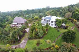 an aerial view of a house with a garden at Samoan Highland Hideaway in Siusega