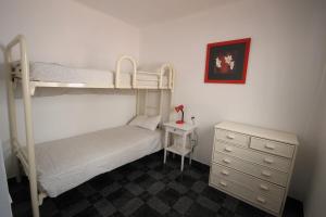 Posteľ alebo postele v izbe v ubytovaní Duplex Fray Junipero