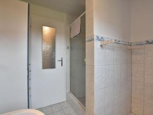 a bathroom with a shower with a glass door at Cozy Apartment in Proseken with Lovely Terrace in Proseken