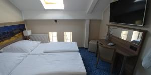 Krevet ili kreveti u jedinici u okviru objekta Hotel Alte Brennerei