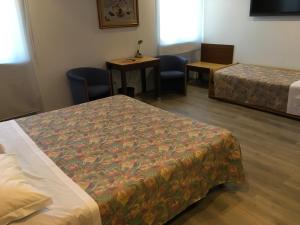 Postel nebo postele na pokoji v ubytování Hotel San Giorgio