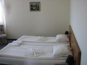 Postel nebo postele na pokoji v ubytování Family Hotel ATLAS