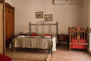 Baglio Scurati tesisinde bir odada yatak veya yataklar