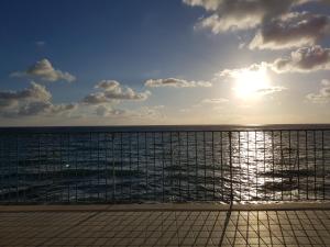 a view of the ocean with the sun in the sky at Villa Ada in Agropoli