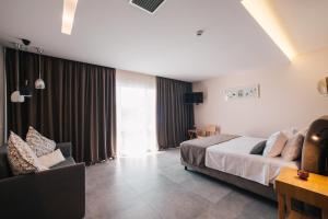 Postel nebo postele na pokoji v ubytování Minoa Hotel