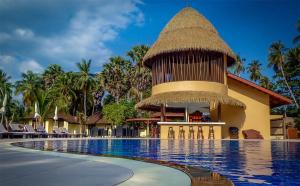 a resort with a swimming pool and a building at Koh Mook Sivalai Beach Resort in Ko Mook