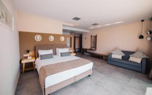 Postel nebo postele na pokoji v ubytování Minoa Hotel