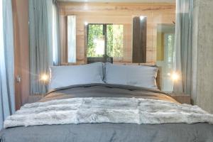 Postel nebo postele na pokoji v ubytování Tulipa Natural Home