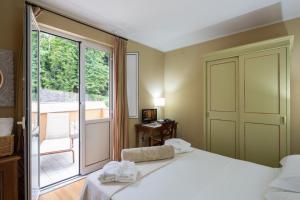 Postel nebo postele na pokoji v ubytování Hotel & Terme Bagni di Lucca