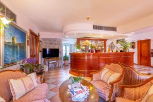 a living room with a couch and a table at Hotel Ostrea in Ston