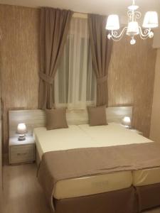 Postel nebo postele na pokoji v ubytování Guest House Adriya