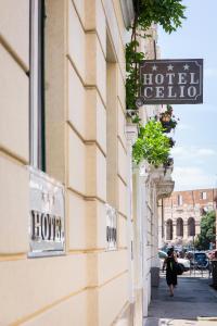 a building with a hotel sign on the side of it at Hotel Celio in Rome