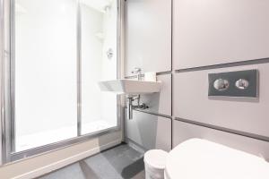 a bathroom with a sink and a toilet at Euro Hostel Edinburgh Halls in Edinburgh