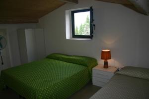 A bed or beds in a room at Casaleaurelia