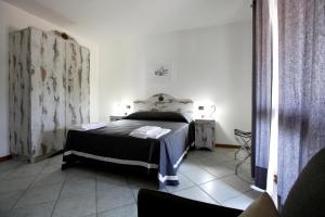 Een bed of bedden in een kamer bij Luxury Room Vittorio Emanuele II