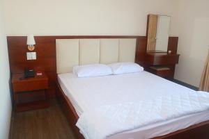 Postel nebo postele na pokoji v ubytování My Ca Hotel