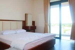 Postel nebo postele na pokoji v ubytování My Ca Hotel