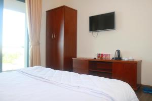 Postel nebo postele na pokoji v ubytování My Ca Hotel