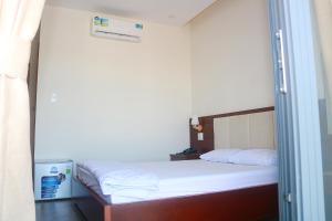 Postel nebo postele na pokoji v ubytování My Ca Hotel