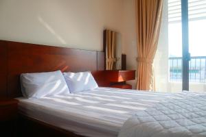 Postel nebo postele na pokoji v ubytování My Ca Hotel