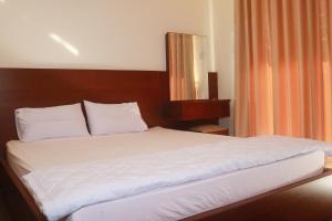 Postel nebo postele na pokoji v ubytování My Ca Hotel