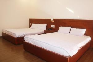 Postel nebo postele na pokoji v ubytování My Ca Hotel
