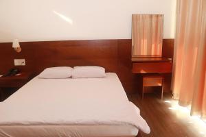 Postel nebo postele na pokoji v ubytování My Ca Hotel