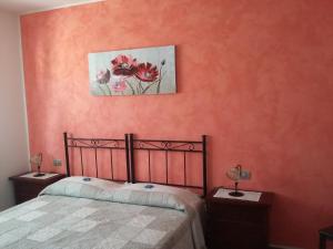 A bed or beds in a room at B&B Itufi