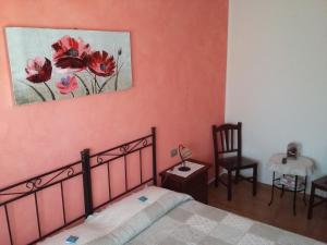 A bed or beds in a room at B&B Itufi