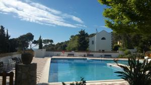 a swimming pool in front of a house at Calella golfet sobremar in Calella de Palafrugell