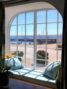 a large window with a view of the beach at Taigh Sonas in Avoch