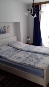 Postel nebo postele na pokoji v ubytování Apartmani Luja