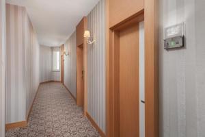 a corridor of a hallway with a long hallway at Golden Orange Hotel in Antalya