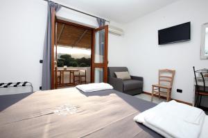 TV a/nebo společenská místnost v ubytování Luxury Room Vittorio Emanuele II