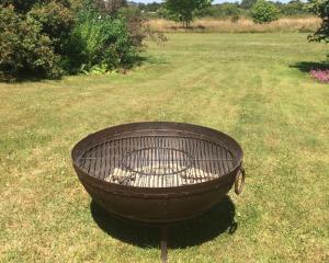a large grill sitting in the middle of a field at Eydon B&B in Daventry